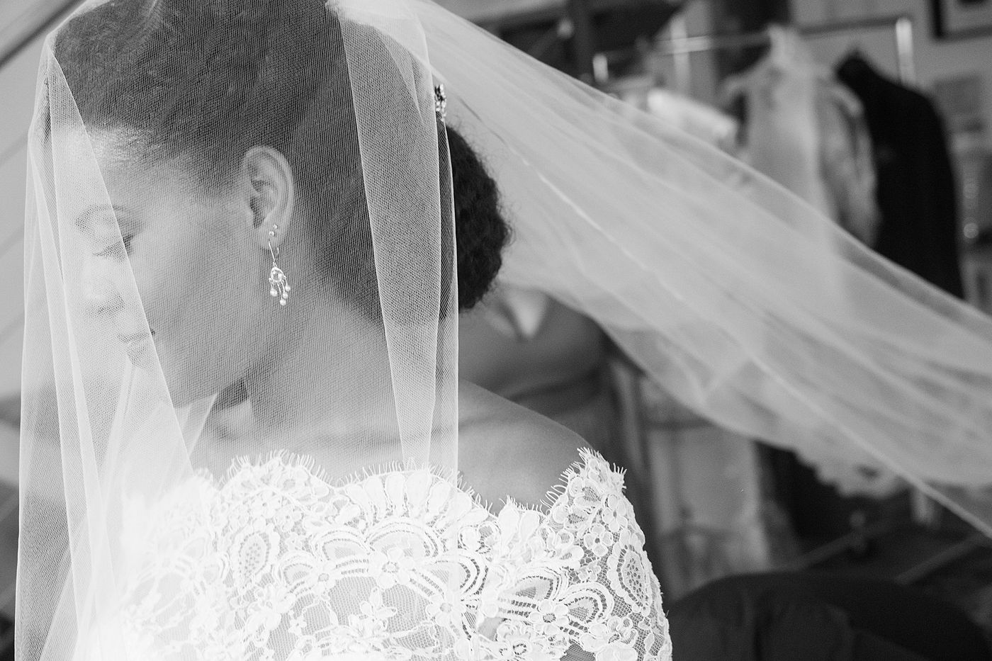 Black-and-white bride beneath her veil